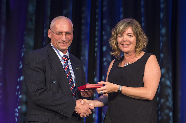Valery Feigin receives MacDiarmid medal from Juliet Gerrard. Photo courtesy of the Royal Society of New Zealand.